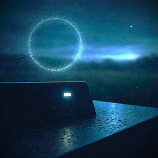 A cursor blinks on a terminal screen at dusk in a rainy field, with an apprition of a circular Ourobous hanging in the air.